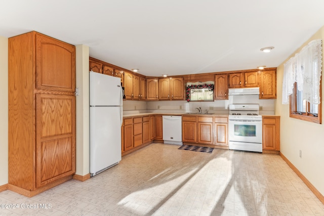 kitchen with white appliances and sink