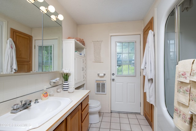 full bathroom with decorative backsplash, vanity, shower / tub combination, tile patterned floors, and toilet