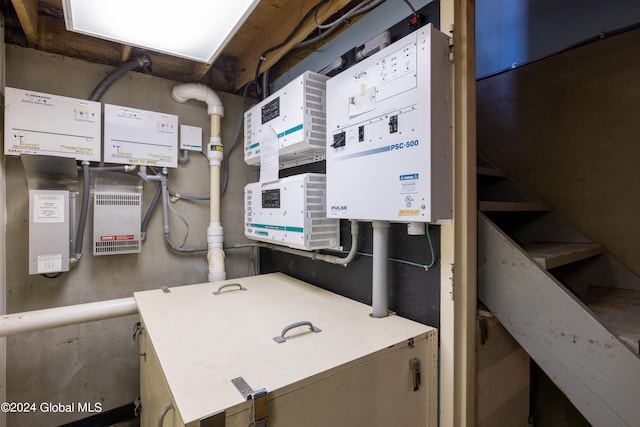 utility room featuring water heater