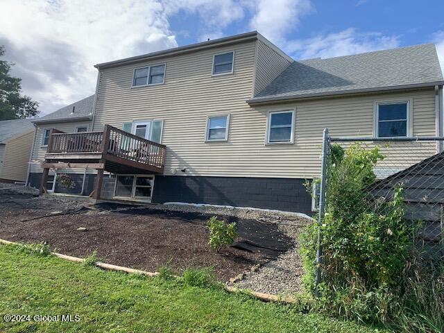 rear view of property with a deck