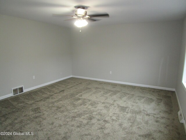 unfurnished room with ceiling fan and carpet floors