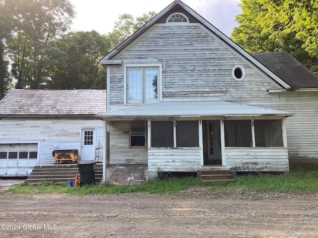 view of front of home with a sunroom