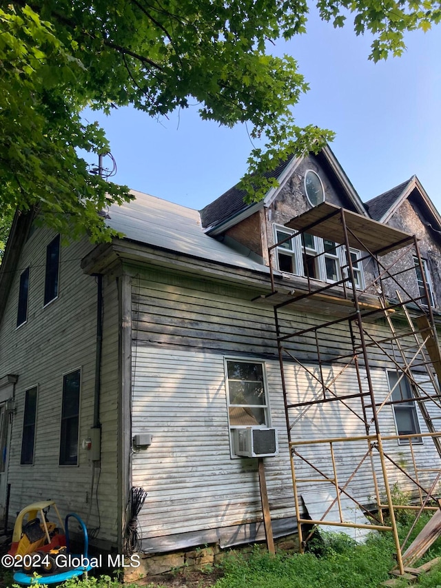 view of home's exterior with a balcony