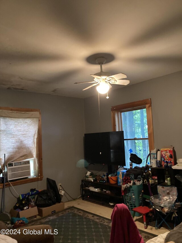 interior space featuring ceiling fan