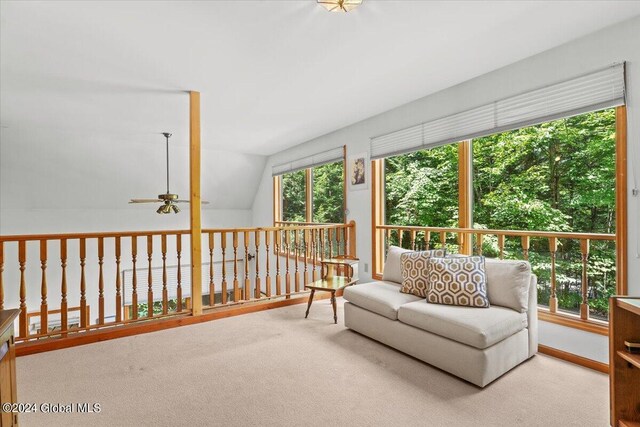 sunroom / solarium featuring vaulted ceiling