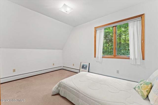 bedroom featuring baseboard heating, vaulted ceiling, and light carpet