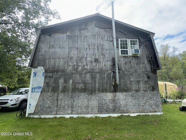 view of home's exterior with a lawn