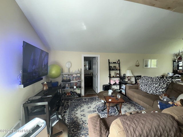 living room with vaulted ceiling and hardwood / wood-style floors