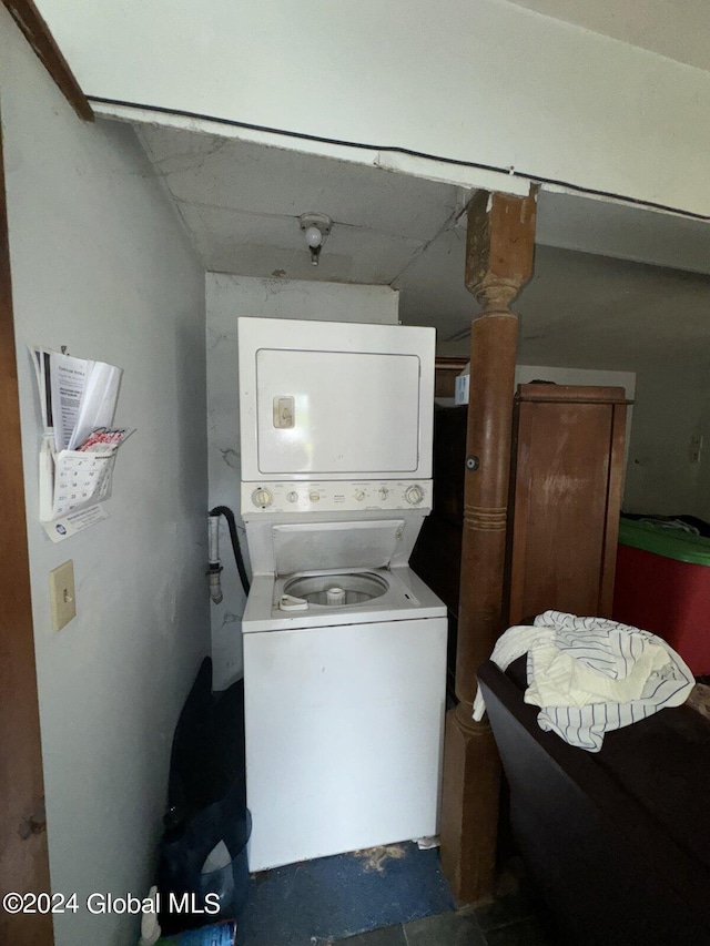 laundry room featuring stacked washer and dryer