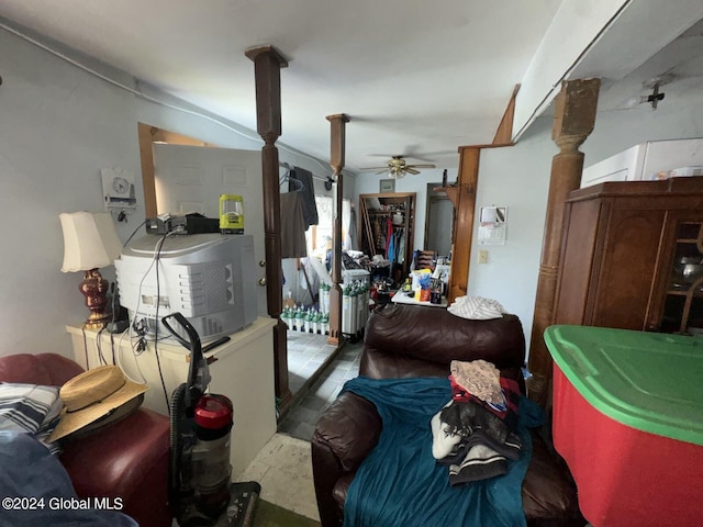 living room with ceiling fan and tile patterned flooring