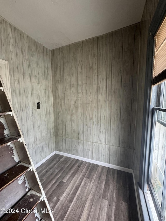 unfurnished room with wood-type flooring