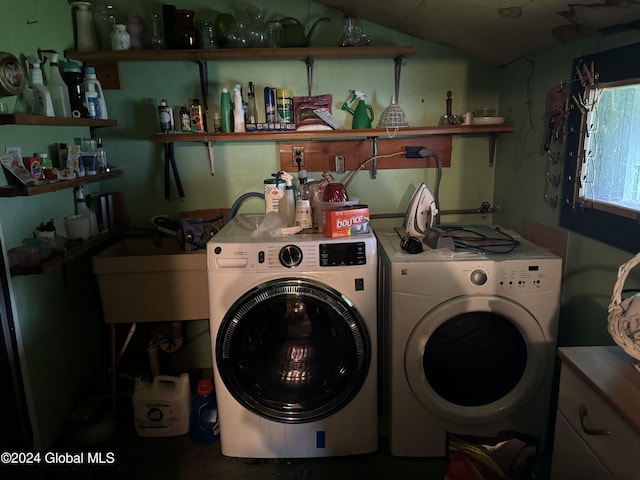 laundry room featuring laundry area, a sink, and washing machine and clothes dryer