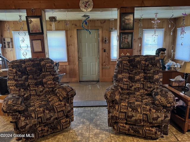 living room featuring wood walls