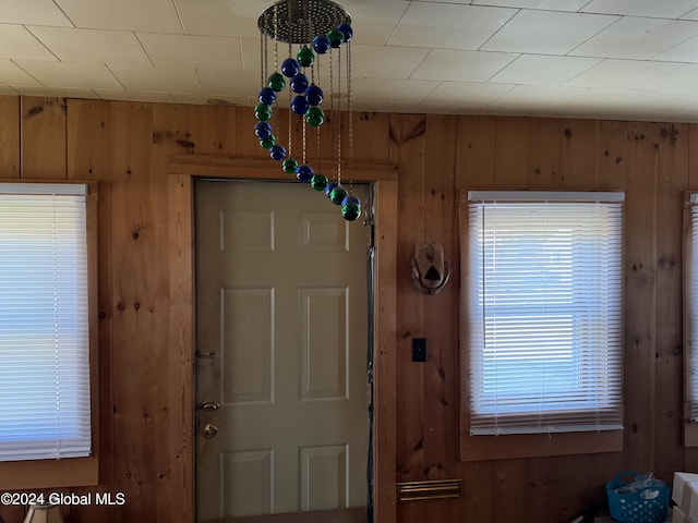 entrance foyer featuring wooden walls