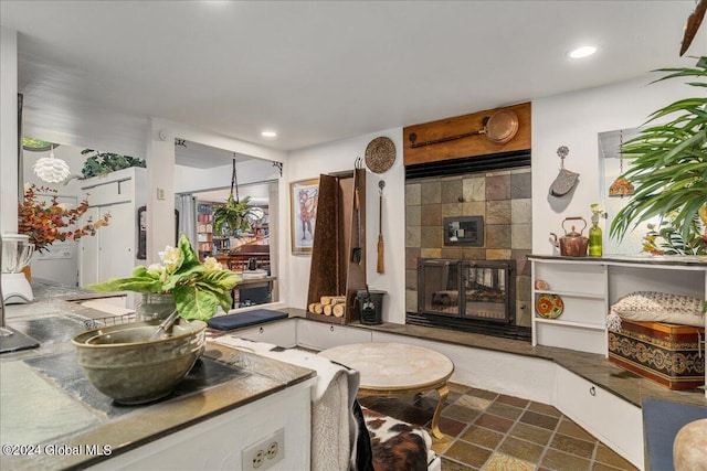 interior space featuring a tile fireplace