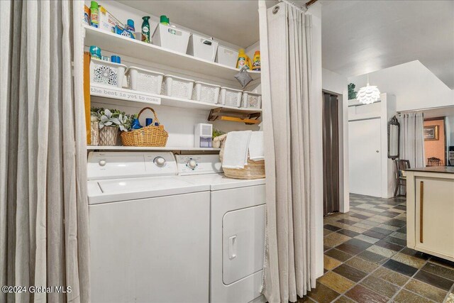 laundry room with washing machine and clothes dryer