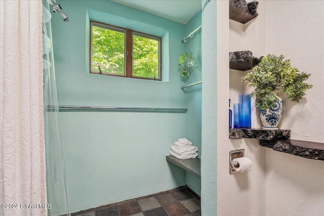 bathroom featuring a shower with curtain