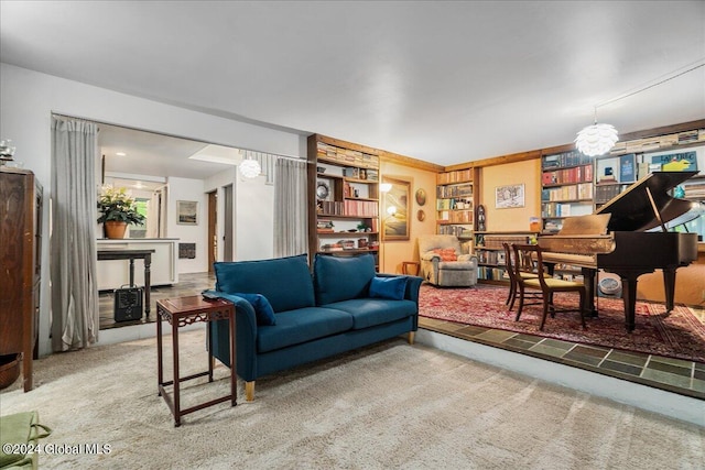 living room with carpet and a chandelier