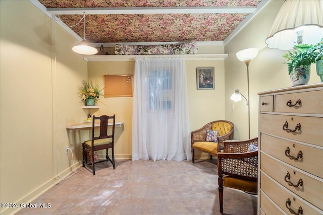 living area featuring crown molding