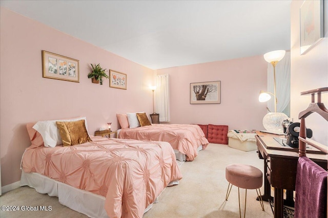 bedroom featuring light colored carpet