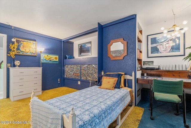 bedroom with a notable chandelier and carpet flooring