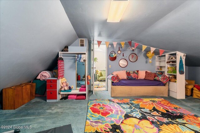 carpeted bedroom with vaulted ceiling