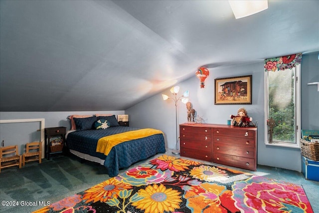 carpeted bedroom with vaulted ceiling