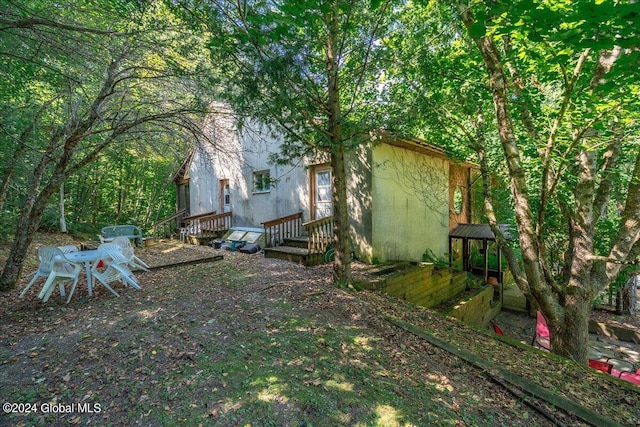 view of yard featuring a wooden deck