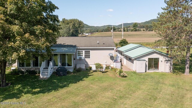 back of house with a yard