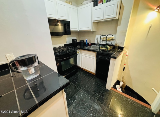 kitchen with black appliances, sink, and white cabinets