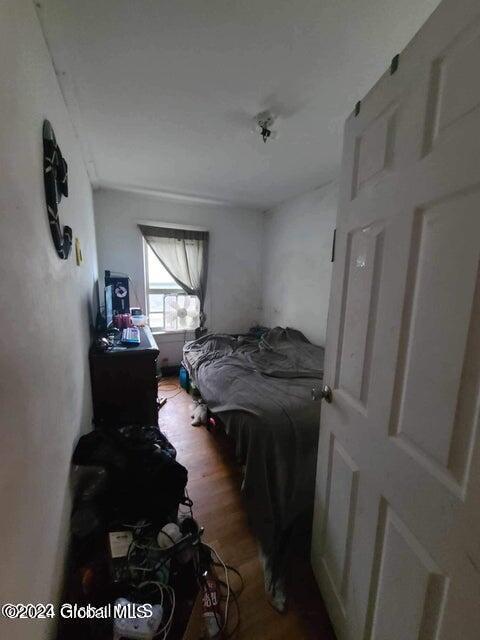 bedroom with wood-type flooring