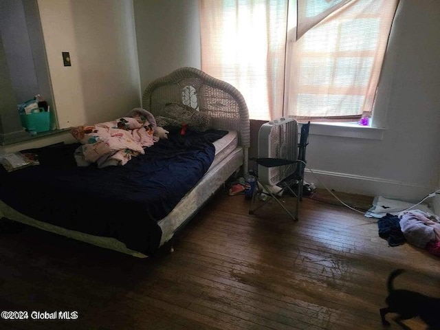 bedroom featuring wood-type flooring