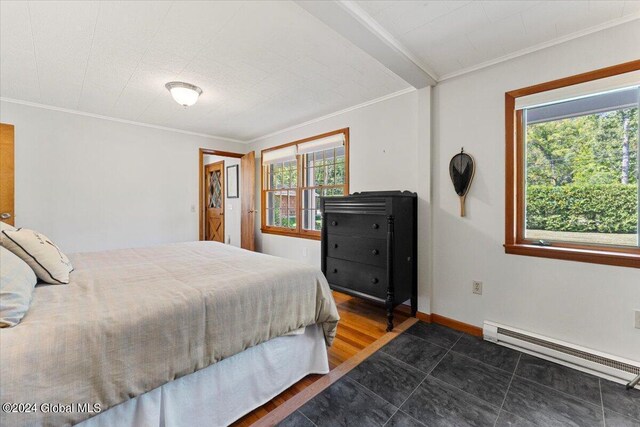 bedroom featuring ornamental molding, dark wood-type flooring, and baseboard heating