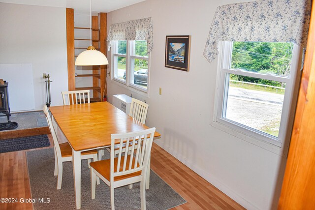 dining space featuring wood-type flooring