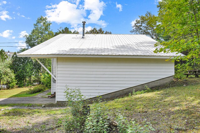 view of property exterior with a yard