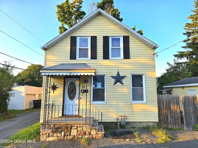 view of front of property featuring fence