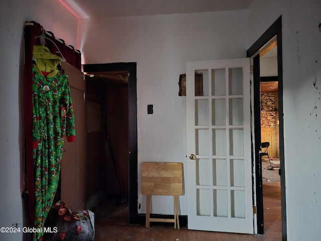 corridor featuring wood finished floors