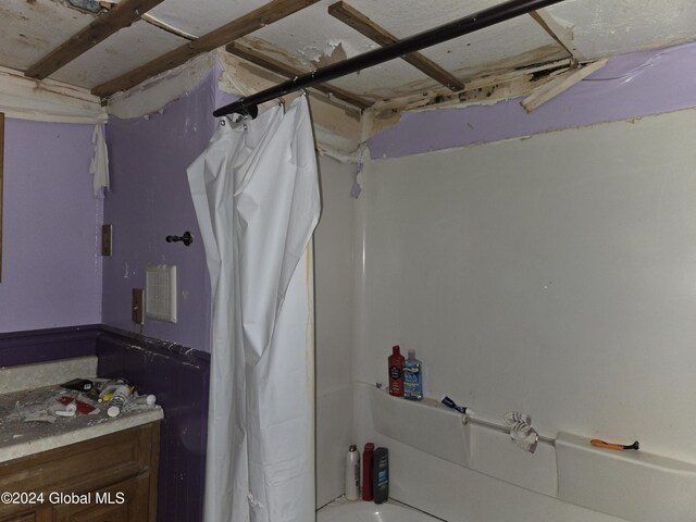 bathroom featuring shower / bath combination with curtain