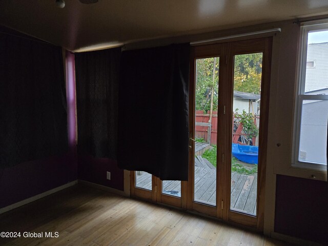 interior space with a wealth of natural light and light hardwood / wood-style floors