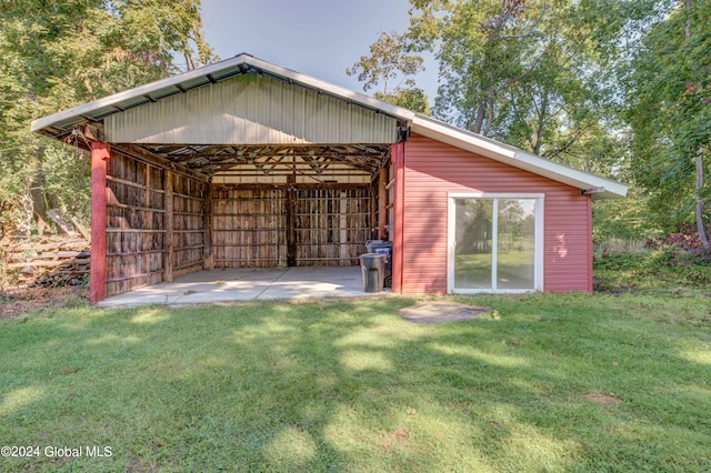 view of outbuilding featuring a yard