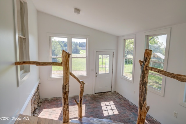 doorway featuring vaulted ceiling