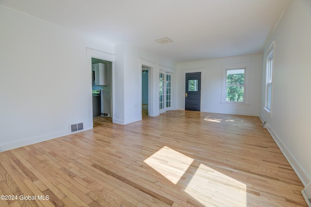 unfurnished living room featuring light hardwood / wood-style floors