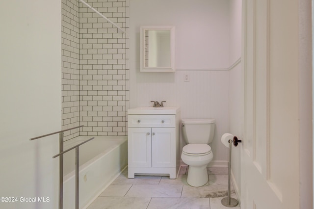 full bathroom featuring toilet, tiled shower / bath combo, and vanity