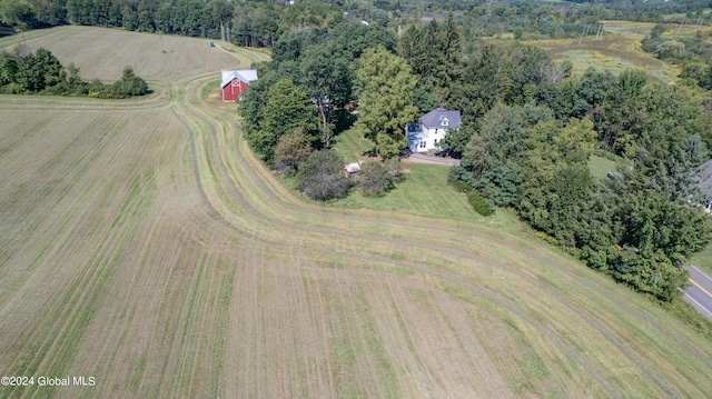 birds eye view of property featuring a rural view