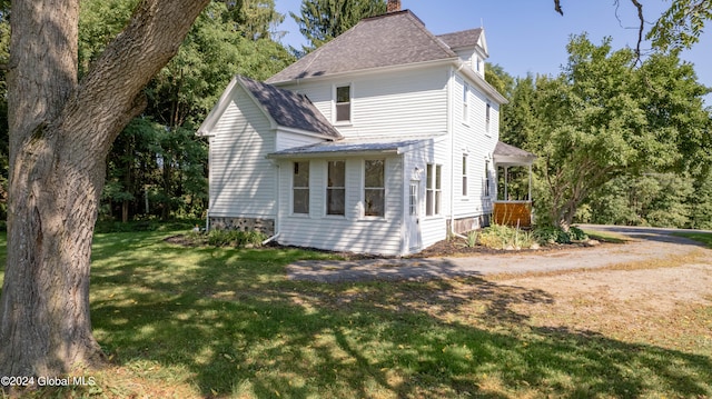 exterior space with a front yard