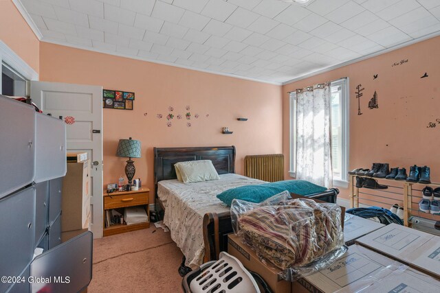 carpeted bedroom featuring multiple windows and crown molding