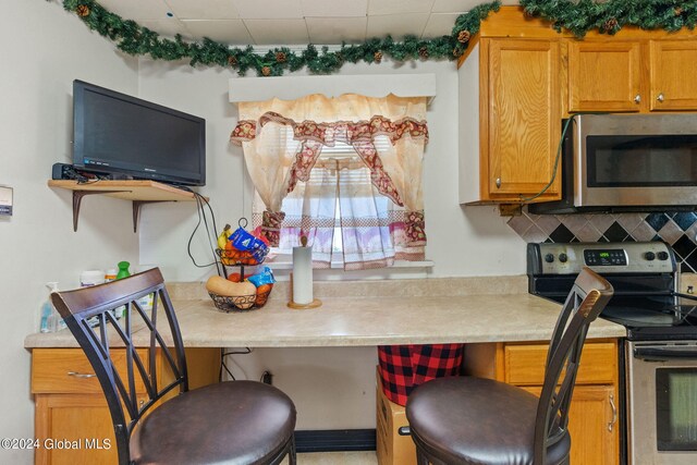 kitchen featuring appliances with stainless steel finishes and backsplash