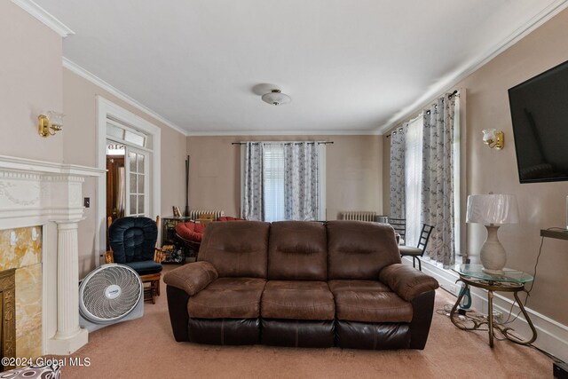 living room with crown molding, carpet flooring, and a high end fireplace