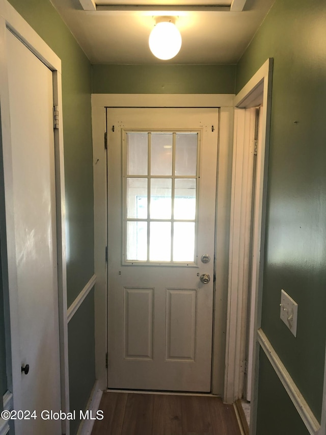 entryway with wood finished floors