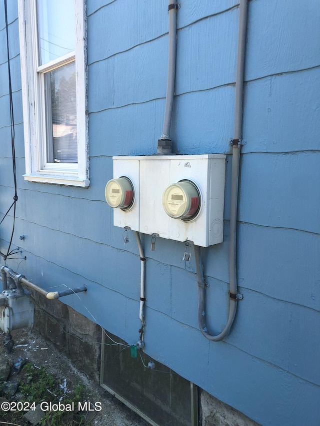 exterior details with electric meter and gas meter